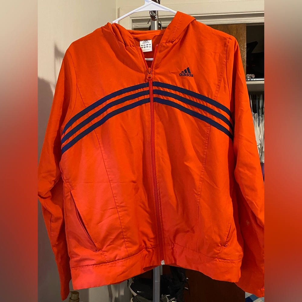 Orange adidas wind breaker , fairly worn, no stains